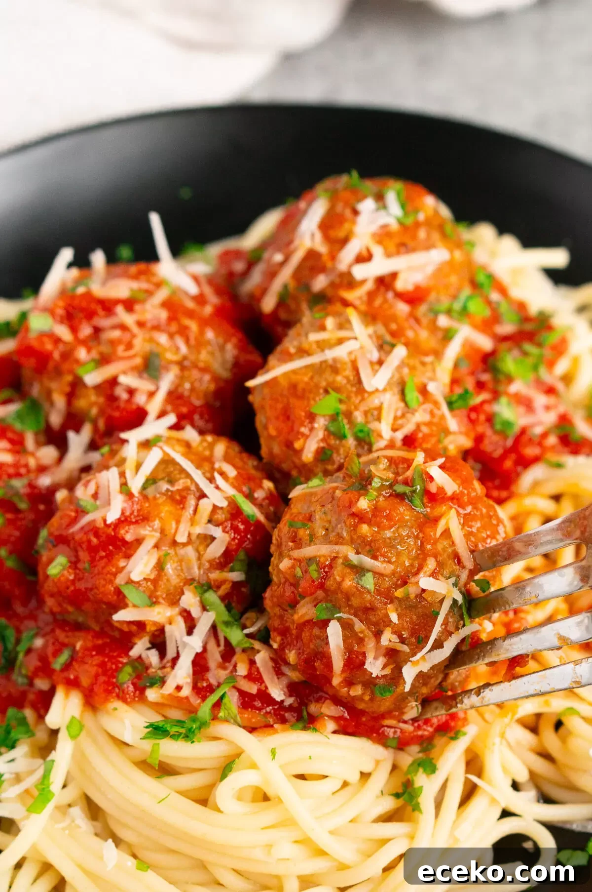 meatballs in marinara sauce over spaghetti