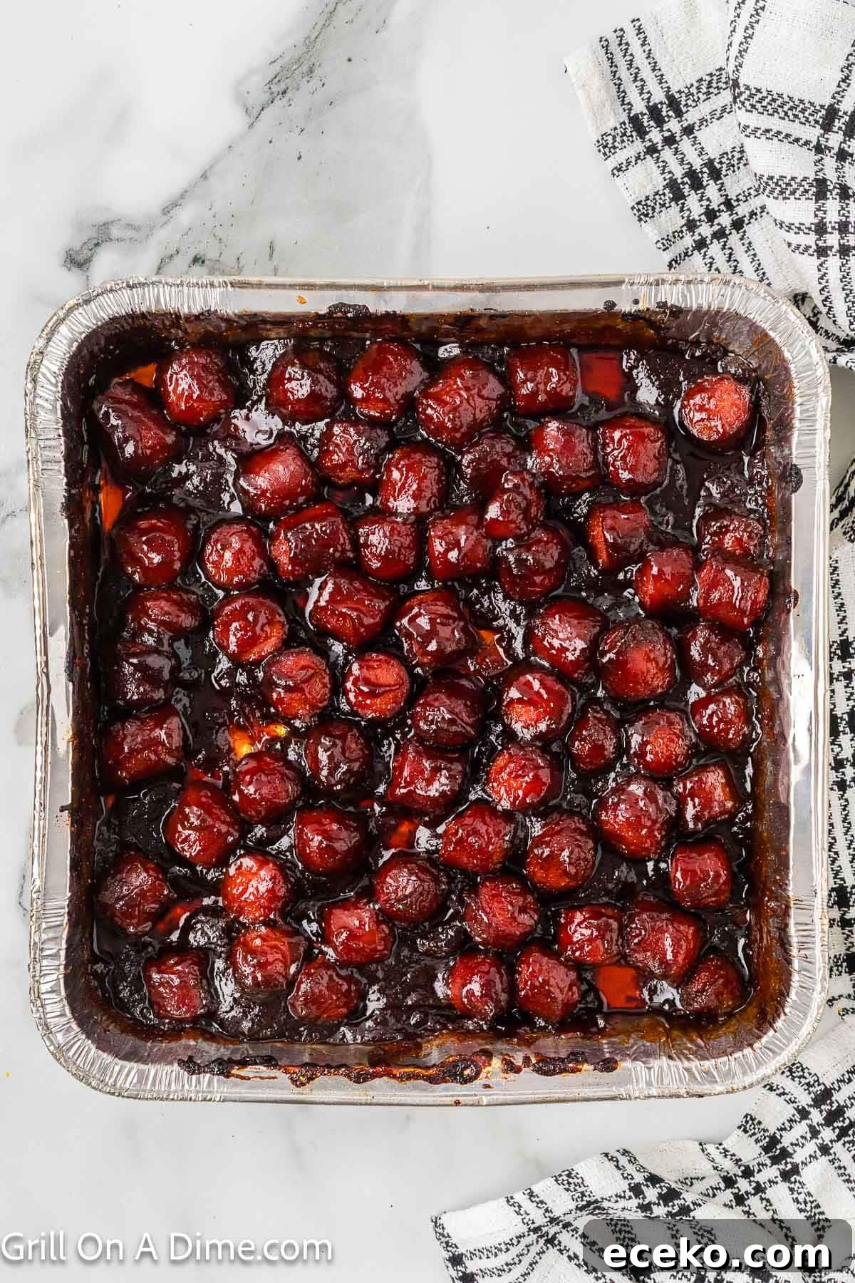 Smoky Burnt Ends Hot Dogs: Crispy, Charred BBQ Bites 9 hot dog pieces cooked in BBQ Mixture in a disposable pan