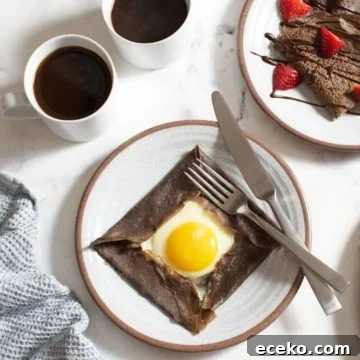 Plates of sweet and savory buckwheat crepes, with two cups of coffee to the left.