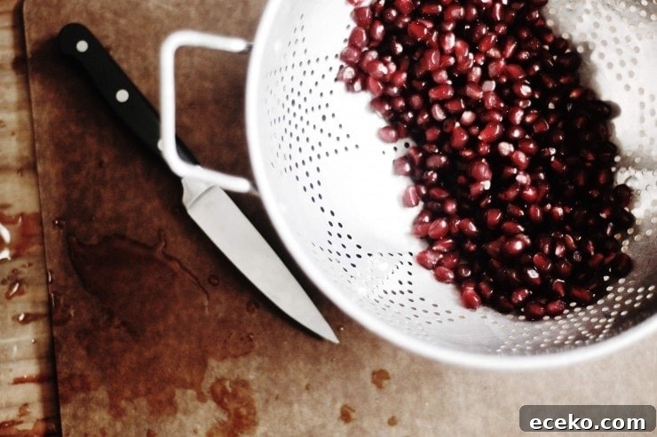 How to Remove Pomegranate Seeds Quickly and Cleanly 7 Pomegranate seeds in colander