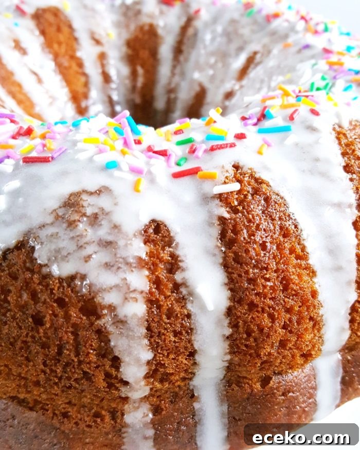 Vanilla Pudding Sour Cream Bundt Cake (Boxed Mix) - Doctored cake mix bundt cake made with sour cream and vanilla pudding. This cake comes out so soft and moist every single time and it tastes like it's homemade! | Beat Bake Eat