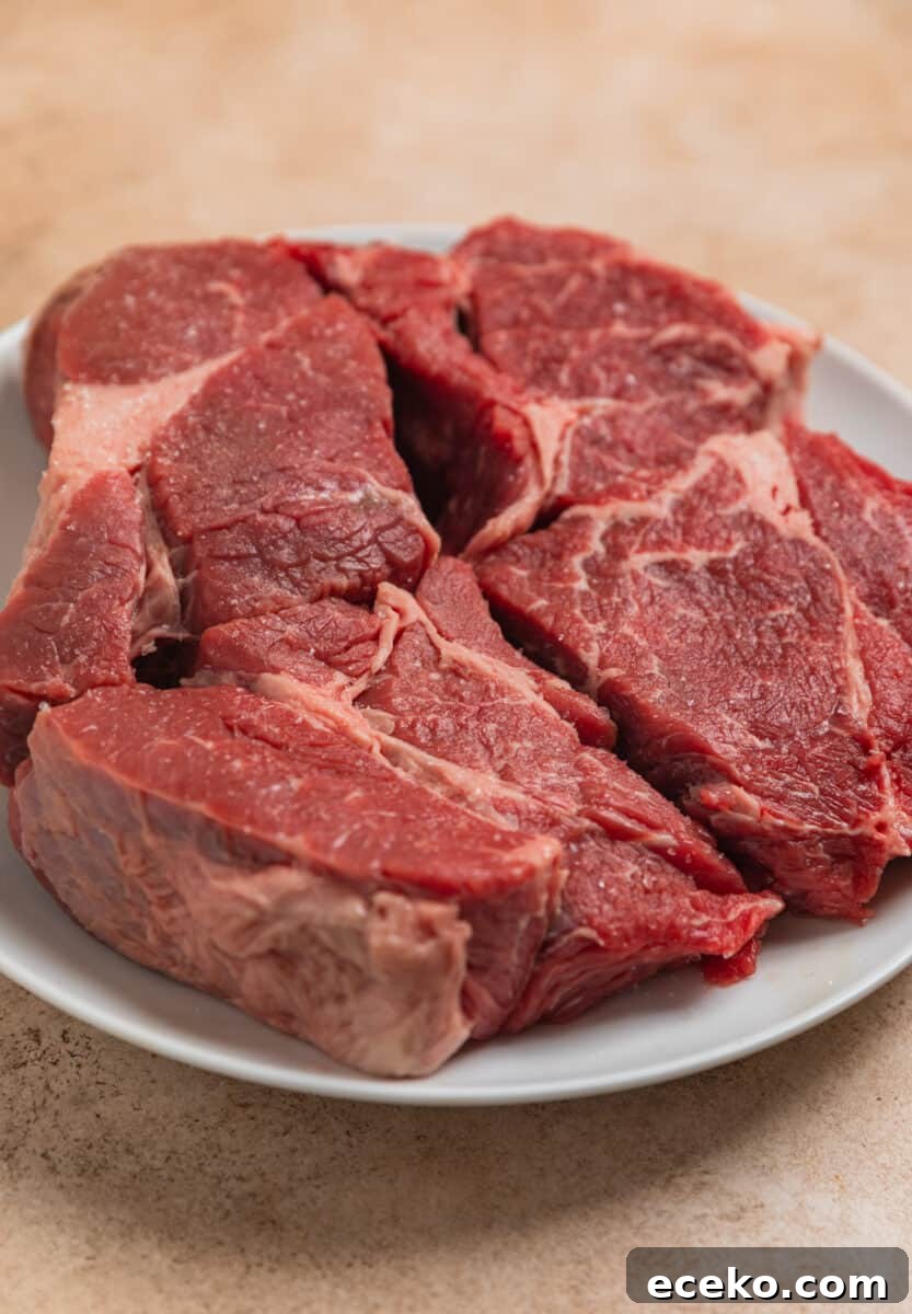 Chuck roast meat on plate with salt.