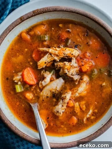 Soup in a bowl with a spoon.