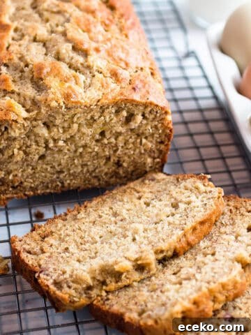 Loaf of sourdough banana bread on a cooling rack