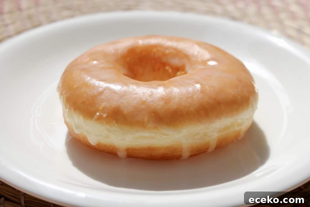 Homemade Doughnuts from a Bread Machine: Simple Recipe for Fluffy Treats 5 Did you know you can make fluffy and delicious yeasted doughnuts in a bread machine? These homemade doughnuts are going to knock your socks off! Glazed, dipped into chocolate, or covered in cinnamon sugar, do what you want! Go nuts with your doughnuts! #donuts #doughnuts #fluffy #homemade #yeasted #glazed #chocolate #sprinkles #doughnutholes #timbits #dunkindonuts #krispykreme #timhortons #breadmachines #fried