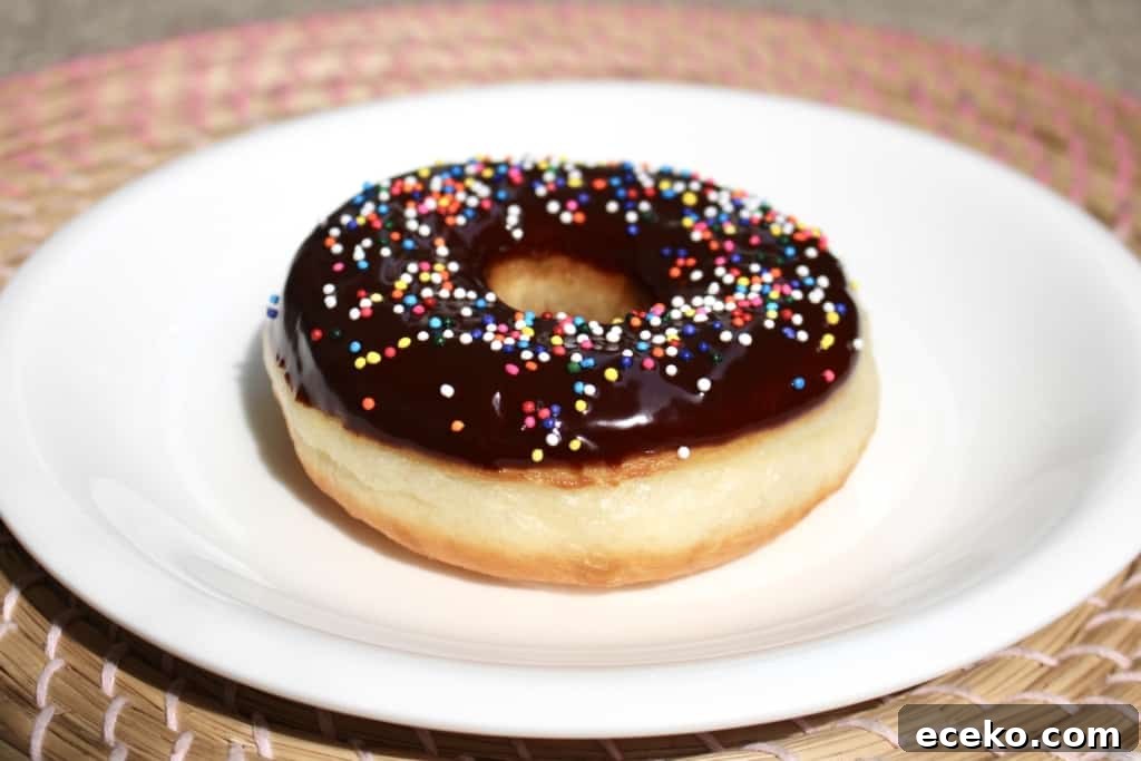 Homemade Doughnuts from a Bread Machine: Simple Recipe for Fluffy Treats 7 Did you know you can make fluffy and delicious yeasted doughnuts in a bread machine? These homemade doughnuts are going to knock your socks off! Glazed, dipped into chocolate, or covered in cinnamon sugar, do what you want! Go nuts with your doughnuts! #donuts #doughnuts #fluffy #homemade #yeasted #glazed #chocolate #sprinkles #doughnutholes #timbits #dunkindonuts #krispykreme #timhortons #breadmachines #fried