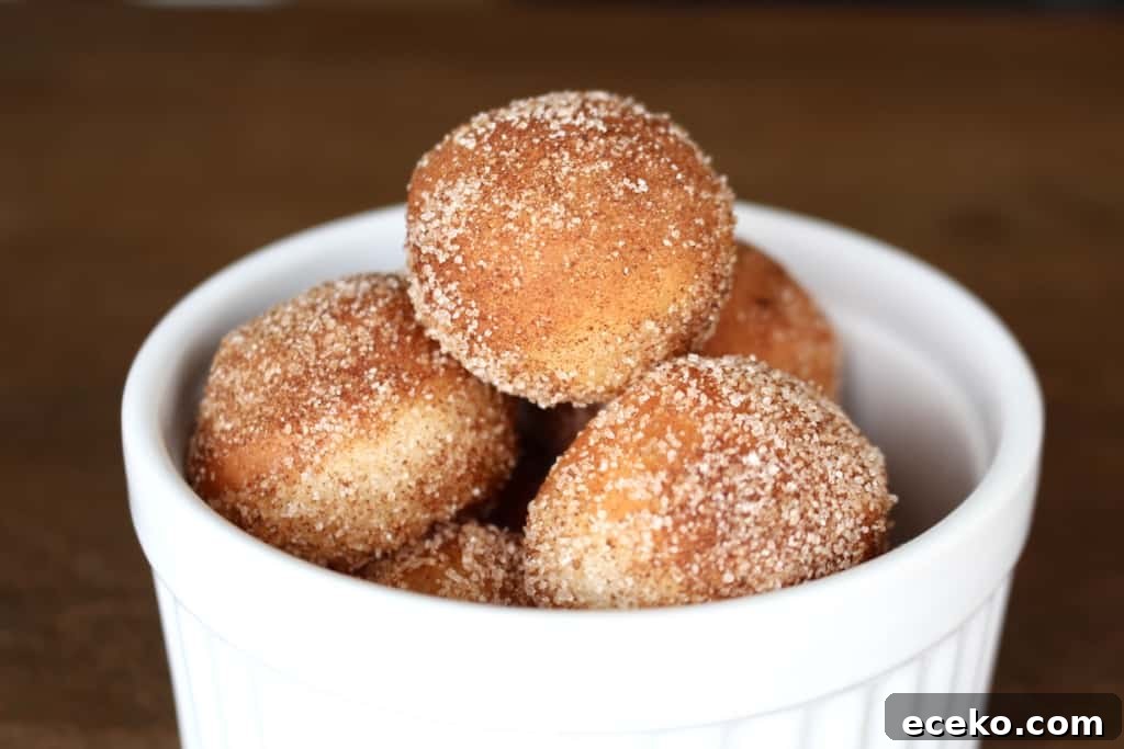 Homemade Doughnuts from a Bread Machine: Simple Recipe for Fluffy Treats 8 Did you know you can make fluffy and delicious yeasted doughnuts in a bread machine? These homemade doughnuts are going to knock your socks off! Glazed, dipped into chocolate, or covered in cinnamon sugar, do what you want! Go nuts with your doughnuts! #donuts #doughnuts #fluffy #homemade #yeasted #glazed #chocolate #sprinkles #doughnutholes #timbits #dunkindonuts #krispykreme #timhortons #breadmachines #fried