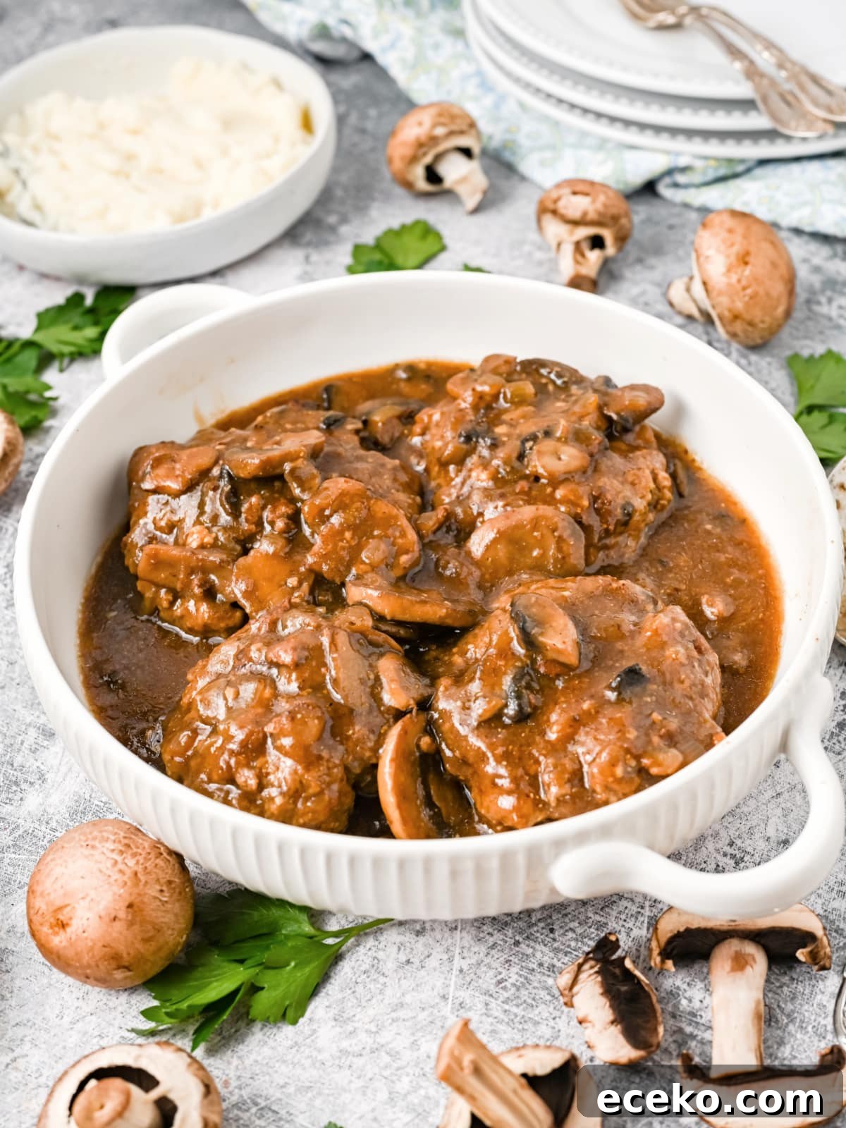 Salisbury Steak and Gravy in white serving dish