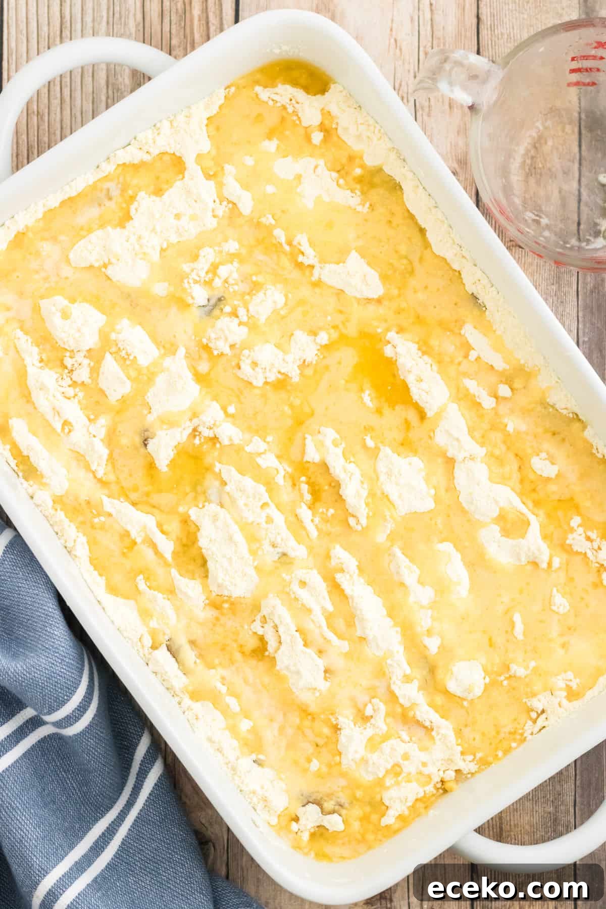 3-Ingredient Apple Dump Cake Recipe: Quick Crowd-Pleasing Dessert 7 Melted butter drizzled over apple pie filling and cake mix.