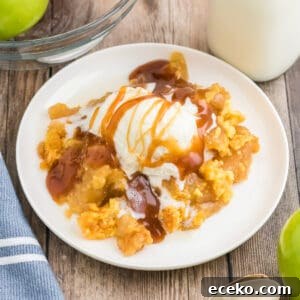 3-Ingredient Apple Dump Cake Recipe: Quick Crowd-Pleasing Dessert 10 Apple dump cake topped with vanilla ice cream and caramel sauce.