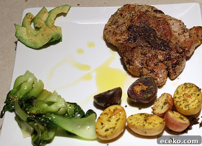 Garlic Butter Pork Chops in a Cast Iron Skillet Recipe 10 Garlic Butter Pork Chop Served with avocado, oven roasted baby potatoes, and baby bok choy
