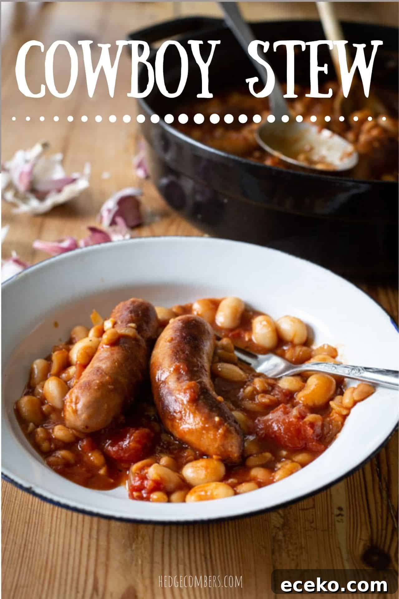 Cowboy Stew Recipes: Campfire, Stovetop, Oven & Slow Cooker Methods 2 white enamel bowl of sausage and bean cowboy stew on a wooden counter with a black cooking pan and garlic cloves in the background