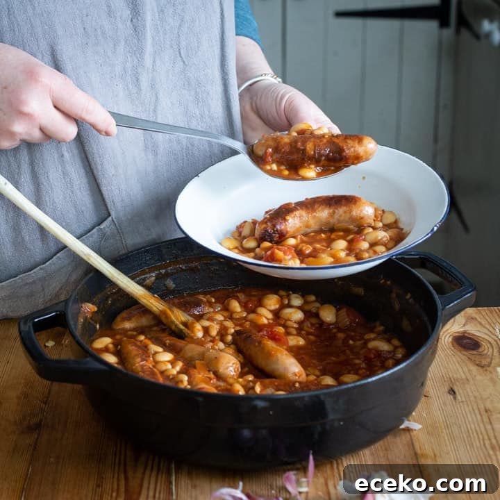Cowboy Stew Recipes: Campfire, Stovetop, Oven & Slow Cooker Methods 12 womans hands dishing up cowboy sausage casserole from a black cast iron pan into a white enamel camping plate