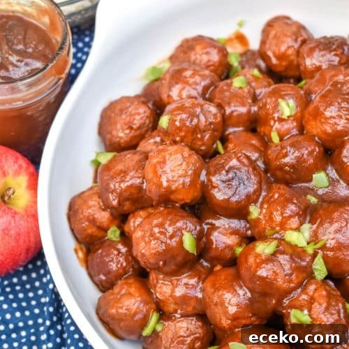 Slow Cooker Apple Butter Meatballs: Sweet Savory Dinner Recipe 8 apple butter meatballs sprinkled with diced green peppers in a white serving bowl