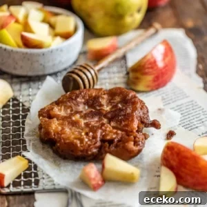 Photo of apple pear fritter on a piece of parchment paper