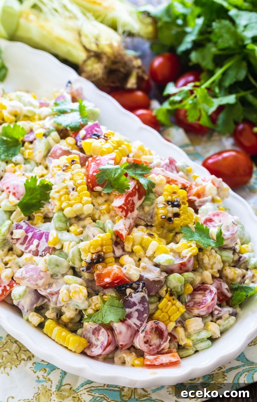 Grilled Corn and Butter Bean Salad on a white serving tray.