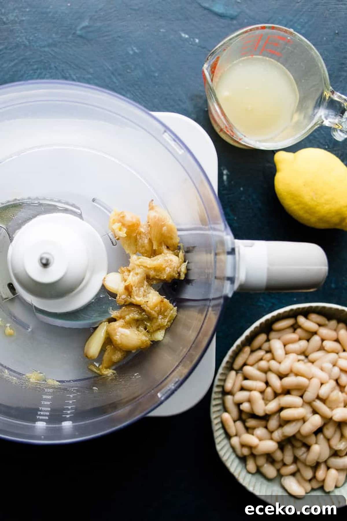 Roasted garlic in a food processor for making white bean dip.
