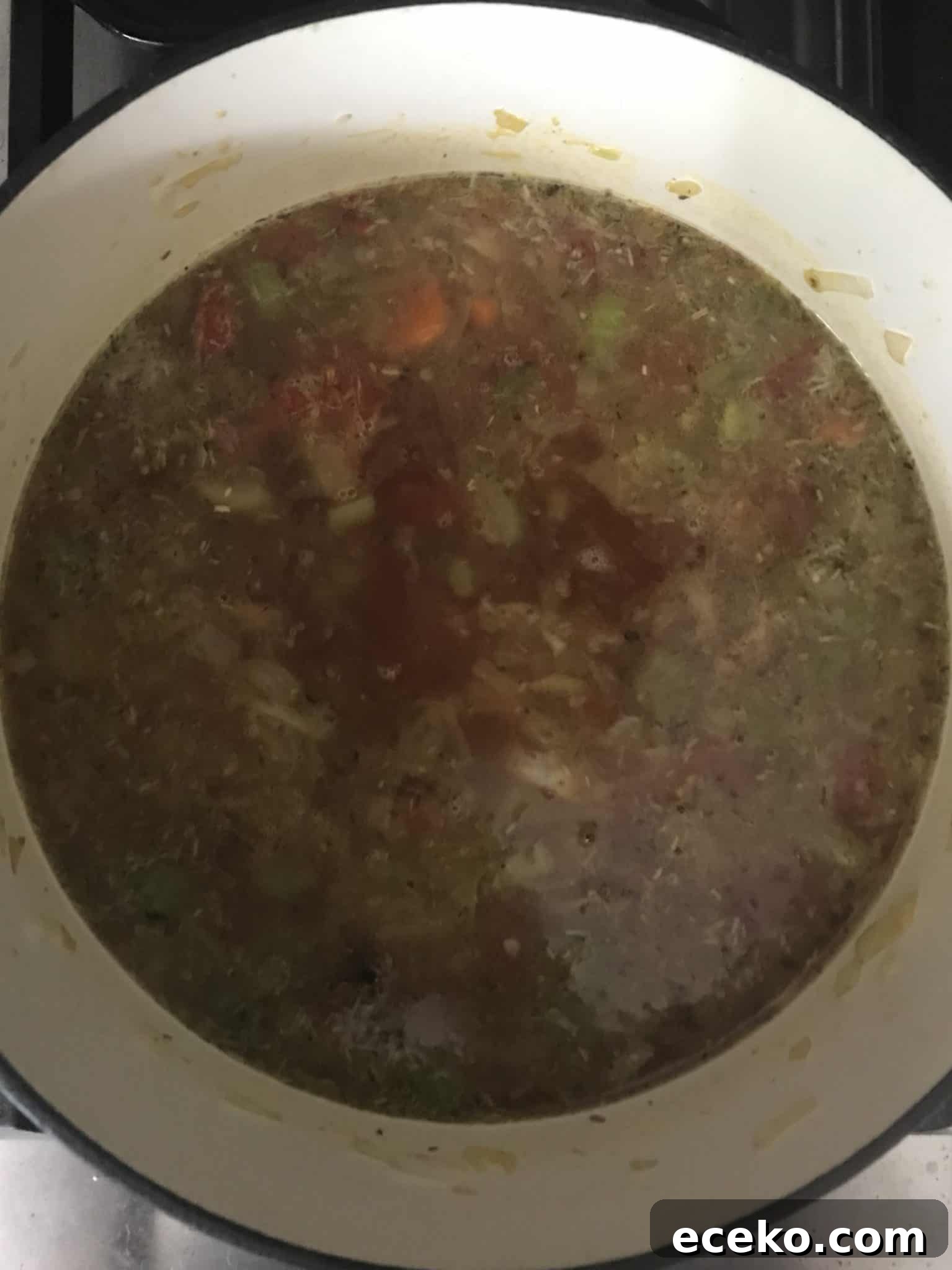 Soup being cooked in pot overhead shot