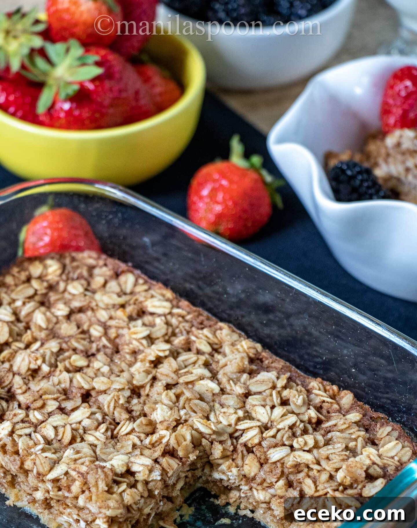 Chewy Baked Oatmeal with Mixed Berries and Maple Drizzle 4 Baked oatmeal served with fruit