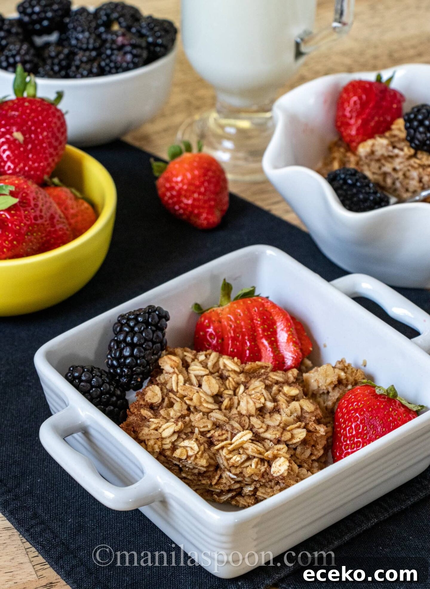 Chewy Baked Oatmeal with Mixed Berries and Maple Drizzle 5 Bowl of baked oatmeal with berries