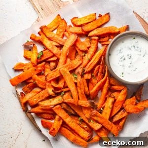 Crispy Frozen Sweet Potato Fries in the Air Fryer 9 air fried frozen sweet potato fries with a dip.