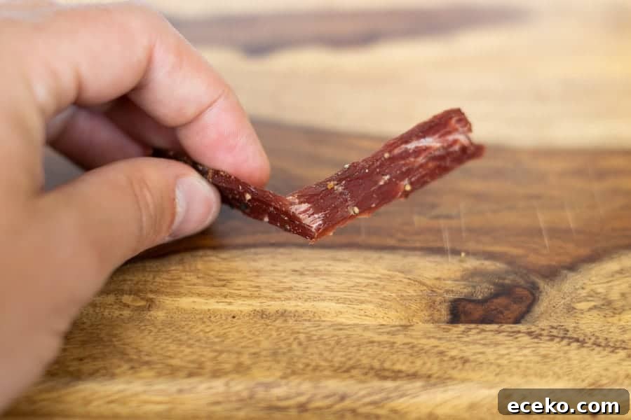 Testing jerky by bending it to see if its finished