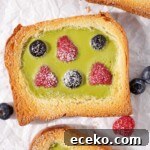 Creamy Matcha Custard Toast Recipe for Breakfast or Brunch 8 Matcha custard toast with raspberries and blueberries.
