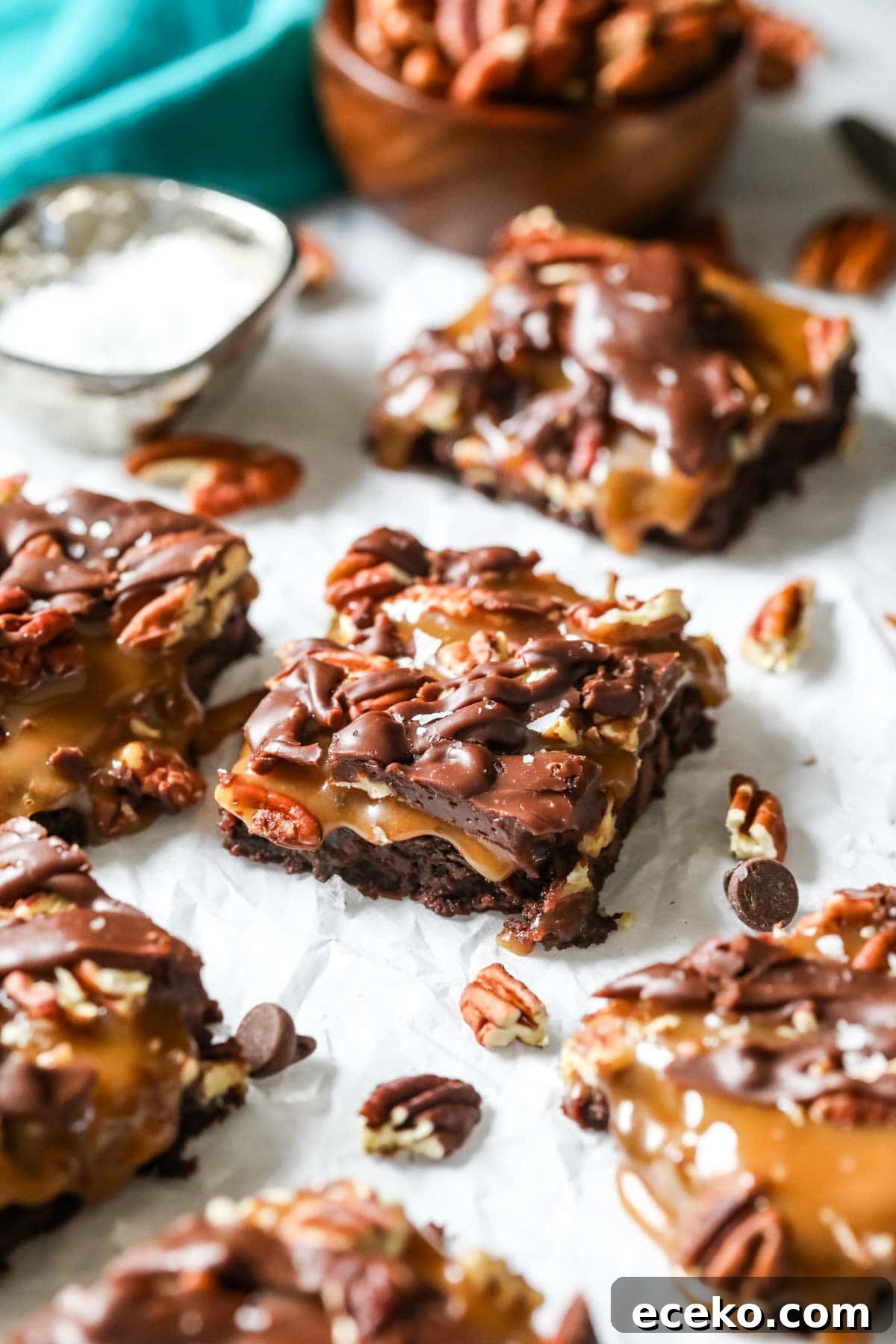 Turtle brownies made with homemade caramel, pecans, a chocolate drizzle, and sea salt.