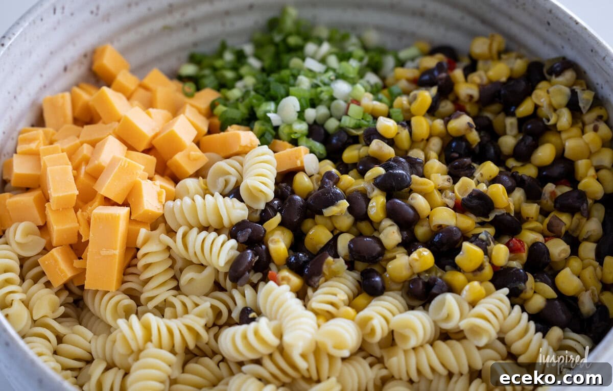 Easy Southwest Chicken Pasta Salad with Creamy Lime Dressing ingredients in a bowl.