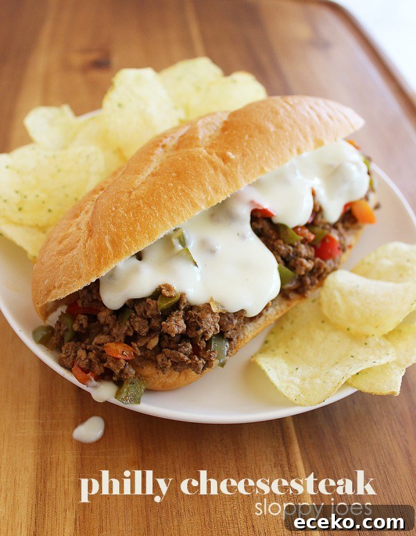 Philly Cheesesteak Sloppy Joes – Try this fun twist on Philly cheesesteaks with bell peppers and a homemade provolone cheese sauce! | thecomfortofcooking.com