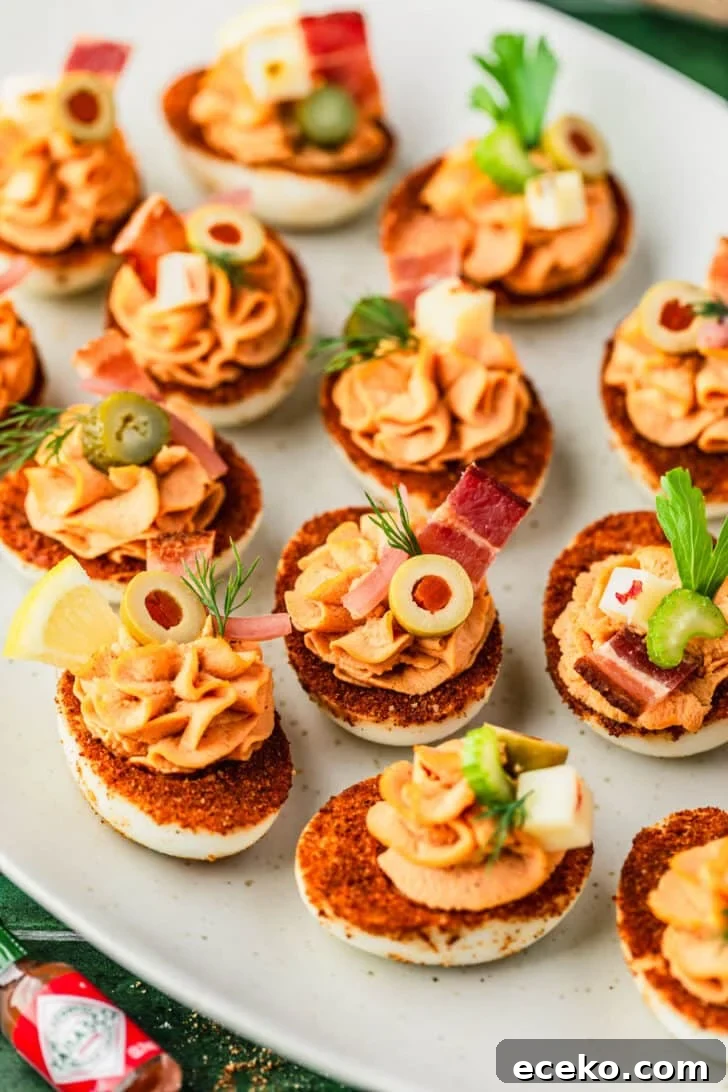 A white platter of Bloody Mary deviled eggs.