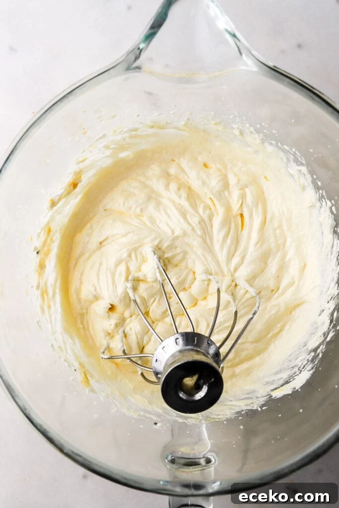 Vanilla Cake with Milk-Soaked Oreo Layers 4 unfinished cake batter in a glass bowl with the whisk attachment