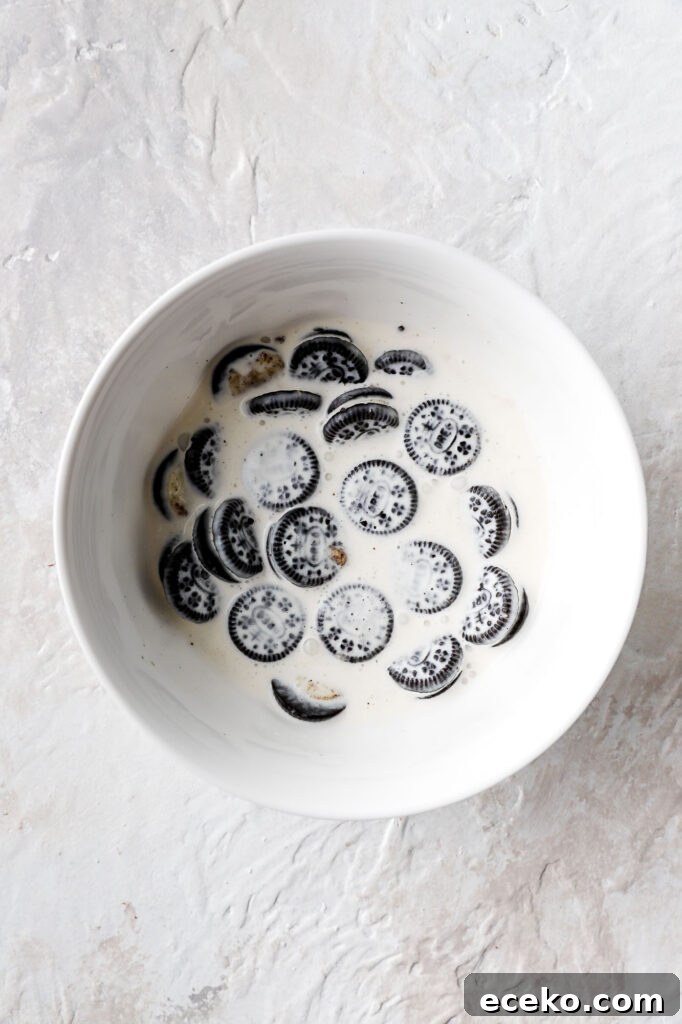 Vanilla Cake with Milk-Soaked Oreo Layers 9 oreos soaking in milk