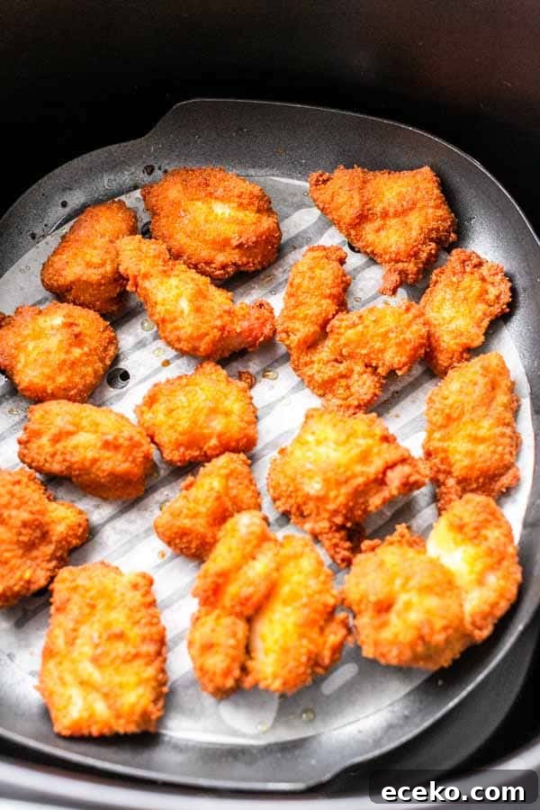 Make the best Air Fryer chicken nuggets with chicken thighs, seasoning and a little bit of oil to turn it into crispy nuggets. You can serve them as a snack, or with dinner.
