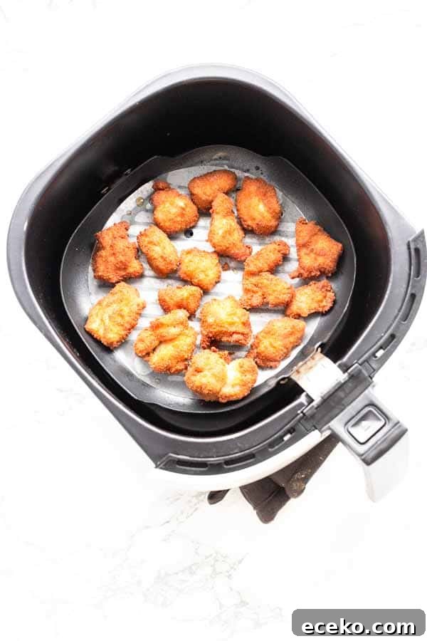 Make the best Air Fryer chicken nuggets with chicken thighs, seasoning and a little bit of oil to turn it into crispy nuggets. You can serve them as a snack, or with dinner.