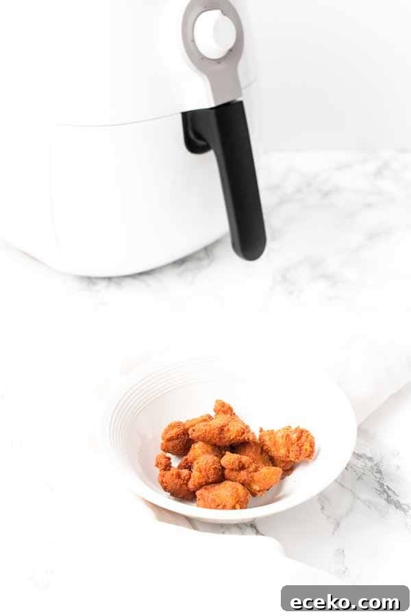 Make the best Air Fryer chicken nuggets with chicken thighs, seasoning and a little bit of oil to turn it into crispy nuggets. You can serve them as a snack, or with dinner.