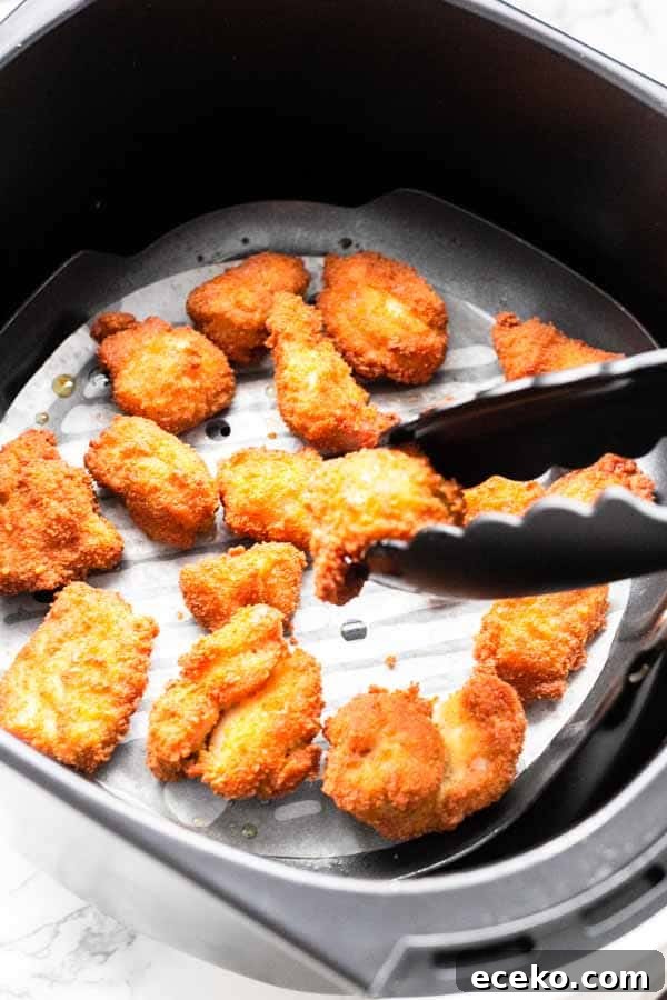 Make the best Air Fryer chicken nuggets with chicken thighs, seasoning and a little bit of oil to turn it into crispy nuggets. You can serve them as a snack, or with dinner.