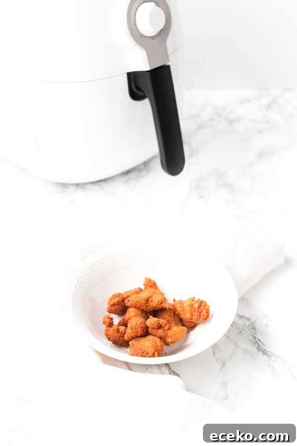 Make the best Air Fryer chicken nuggets with chicken thighs, seasoning and a little bit of oil to turn it into crispy nuggets. You can serve them as a snack, or with dinner.