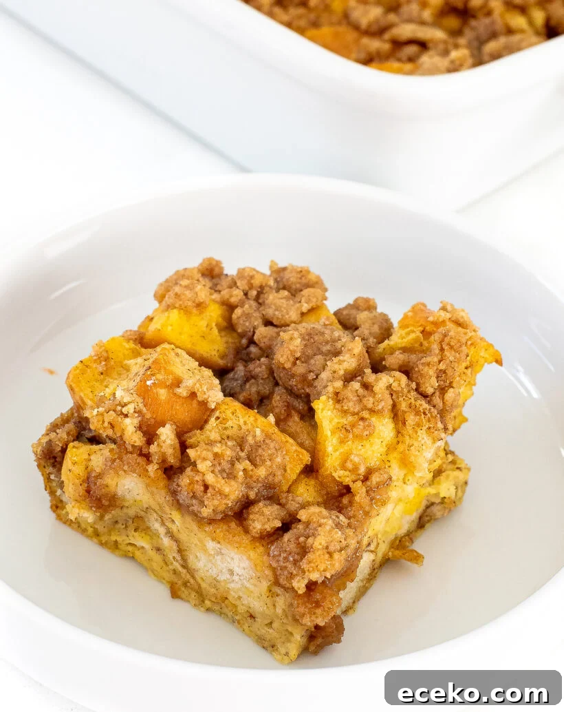 A piece of eggnog casserole on a white plate.