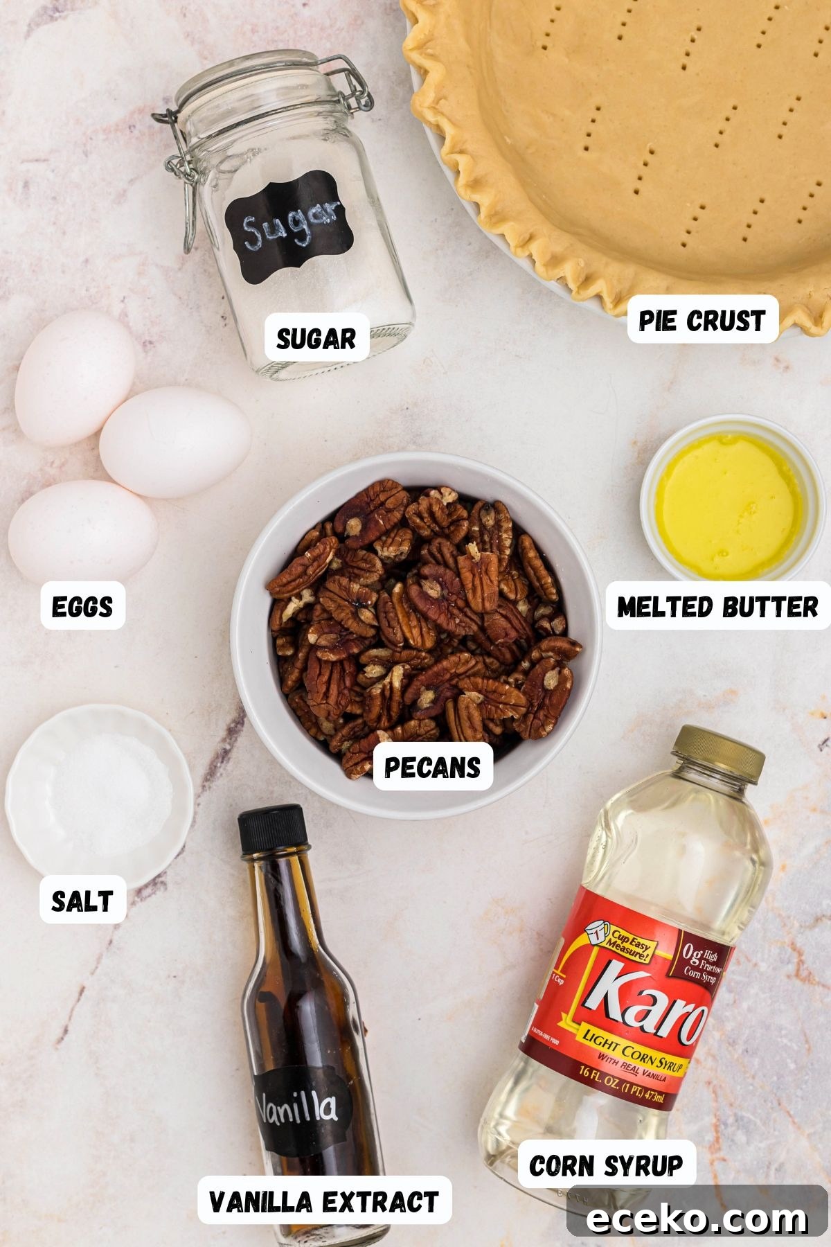 Ingredients measured into small bowls and labeled, on a marble table.