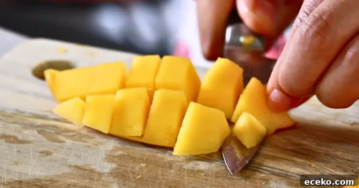 removing a skin of fresh mangos