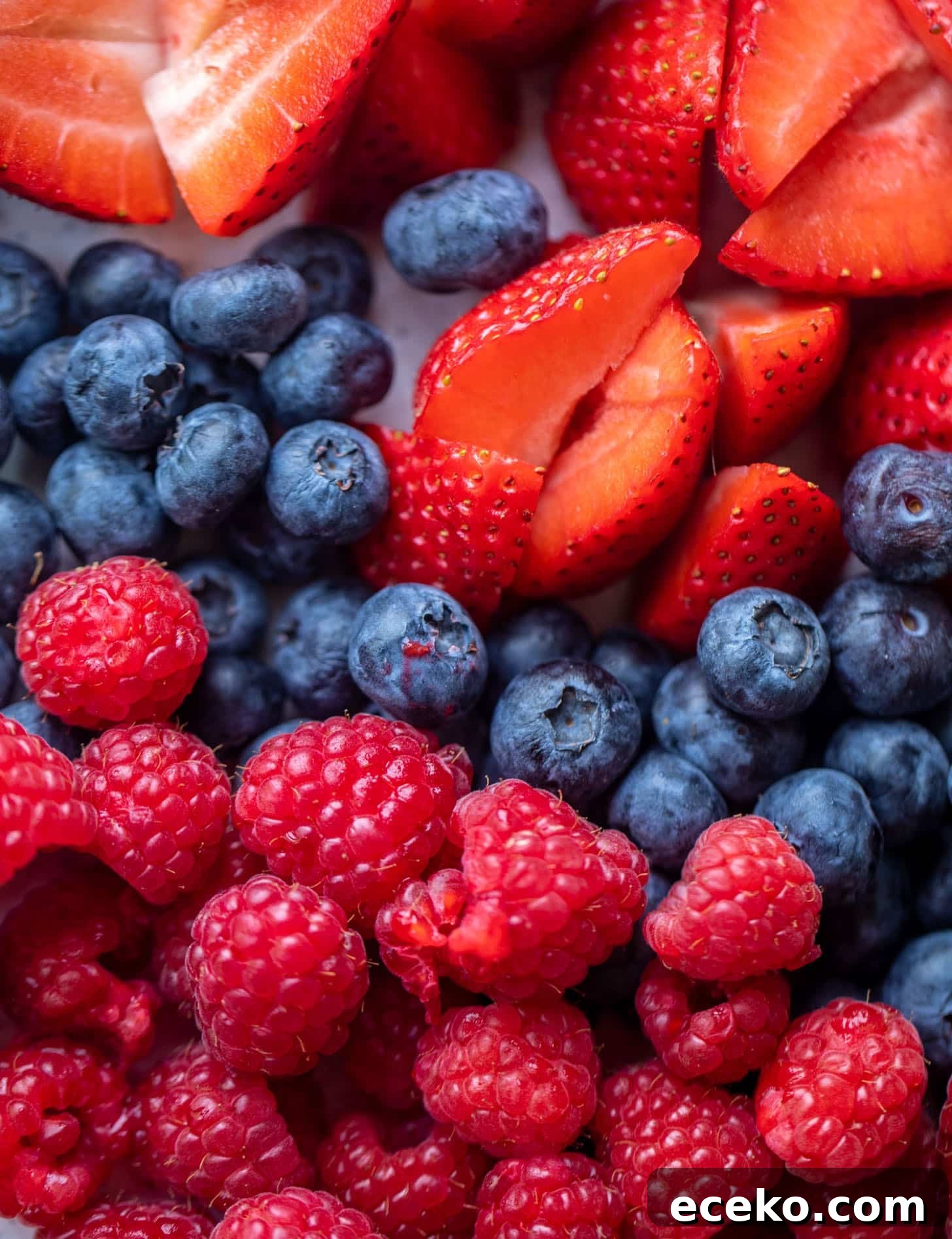 Triple-Berry Trifle with Fresh Raspberry Sauce 3 strawberries, blueberries, raspberries