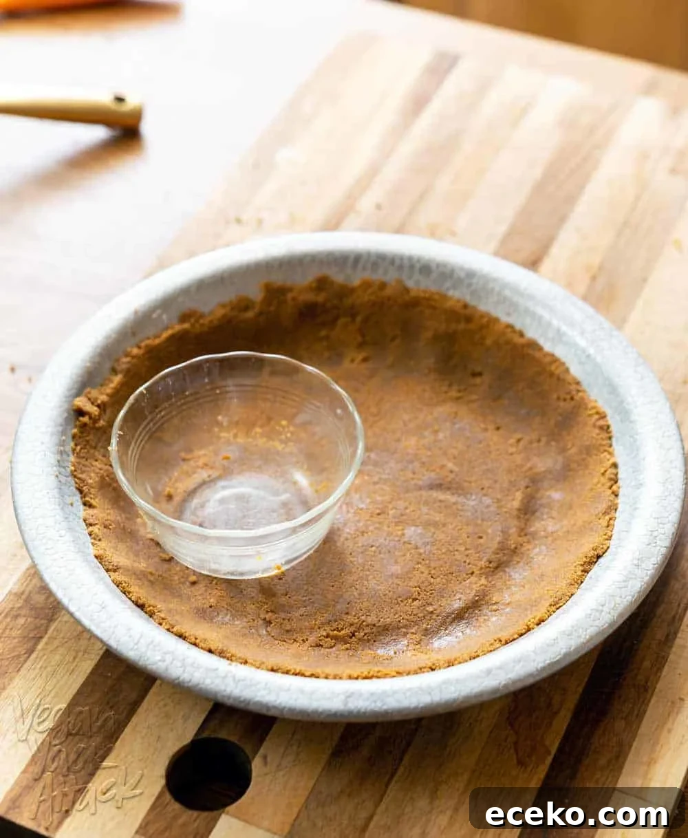Gluten-free graham cracker pie crust in a metal pie pan