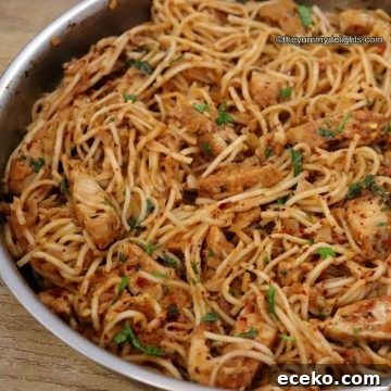 spicy chicken spaghetti in a skillet.