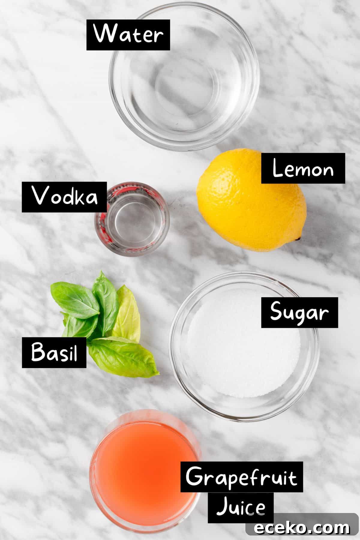 The ingredients needed to make a grapefruit martini.