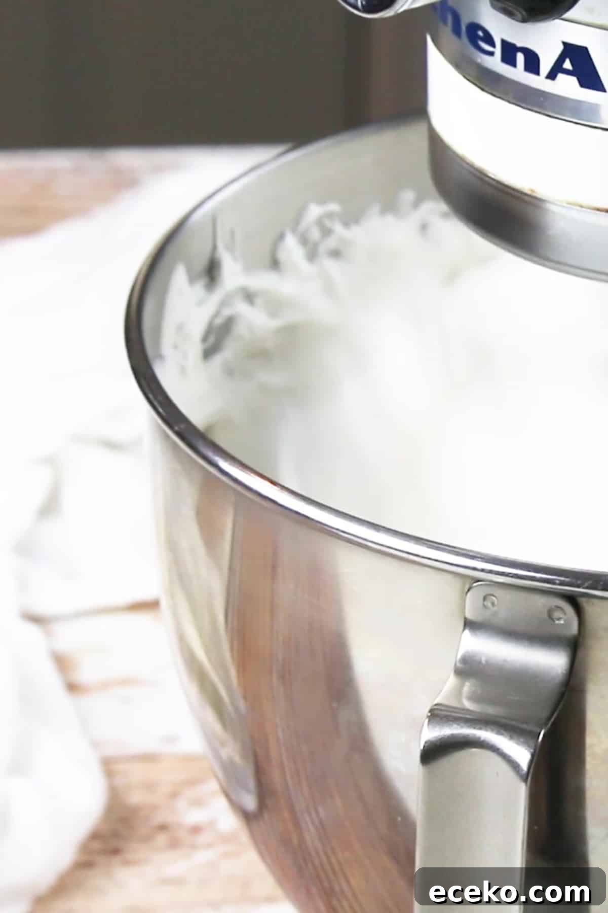 Homemade Marshmallows Without Corn Syrup — Simple Recipe 7 marshmallows being whipped in a KitchenAid mixer.