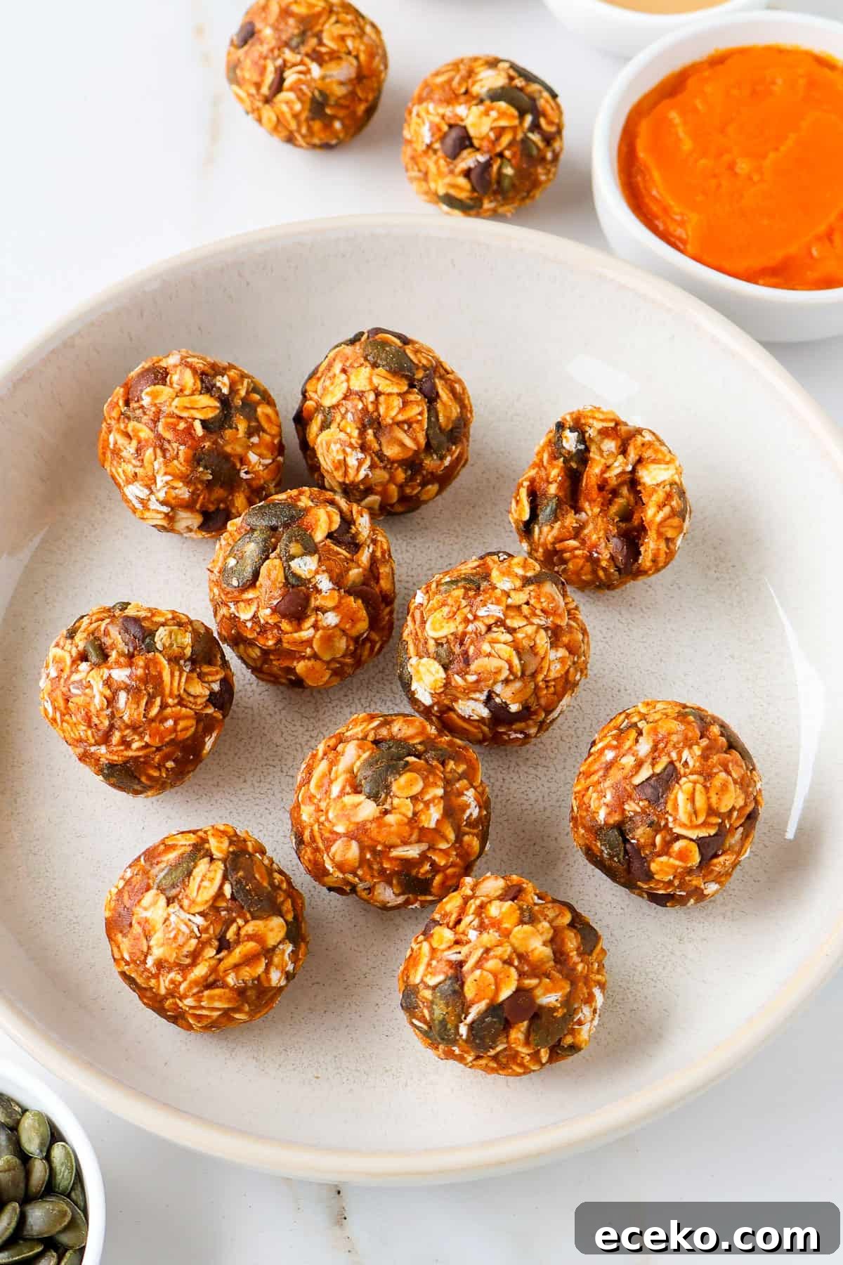 Side shot of protein balls in a bowl.