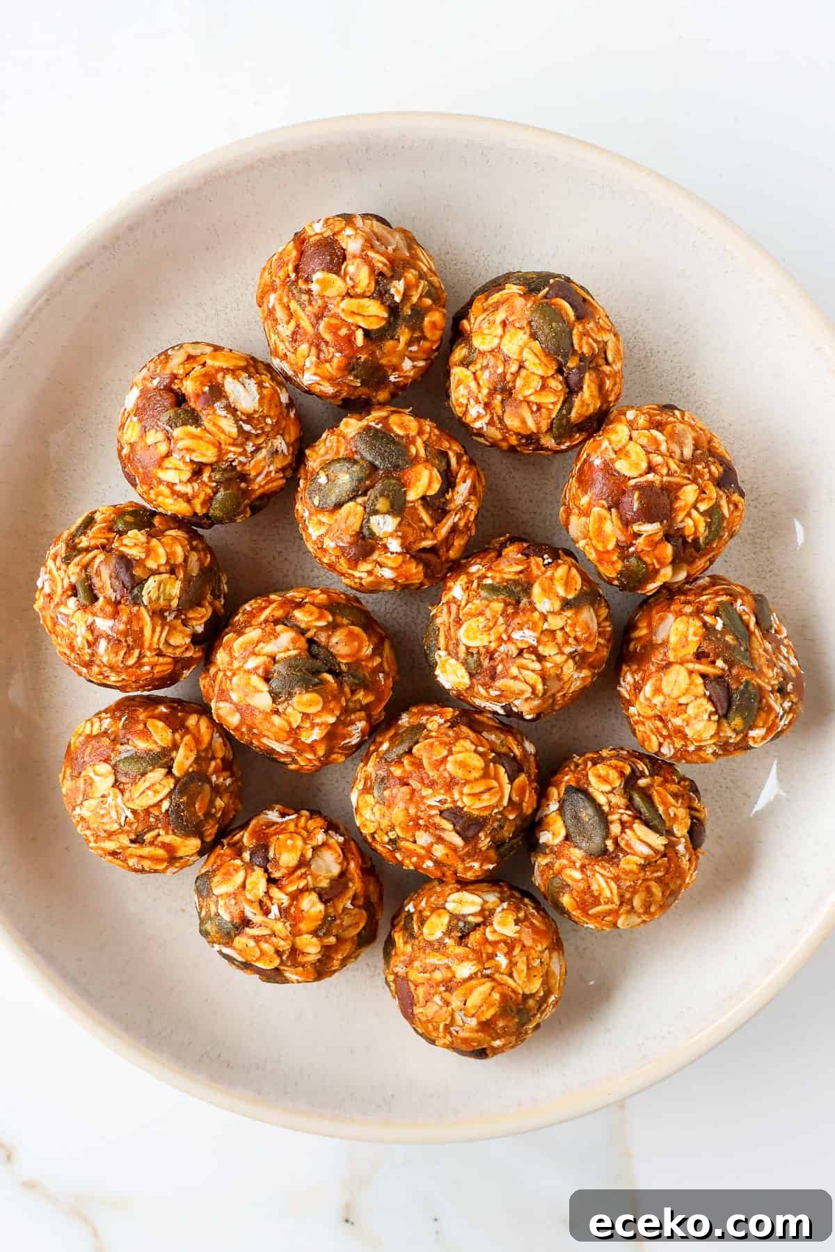 Pumpkin protein balls in a bowl.