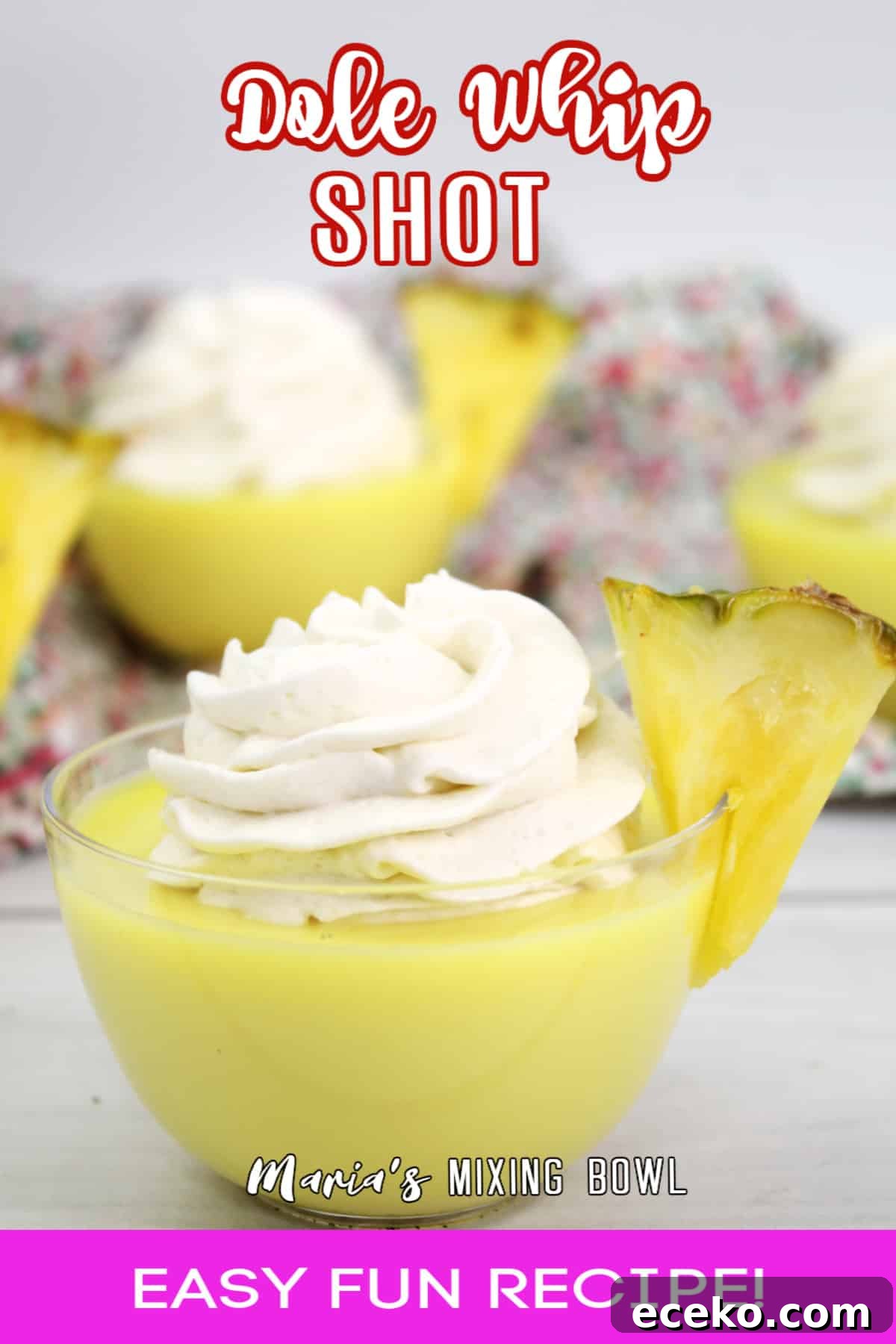 Dole Whip Shot Recipe: How to Make the Creamy Tropical Cocktail 7 dole whip shot in a small glass bowl garnished with a slice of pineapple
