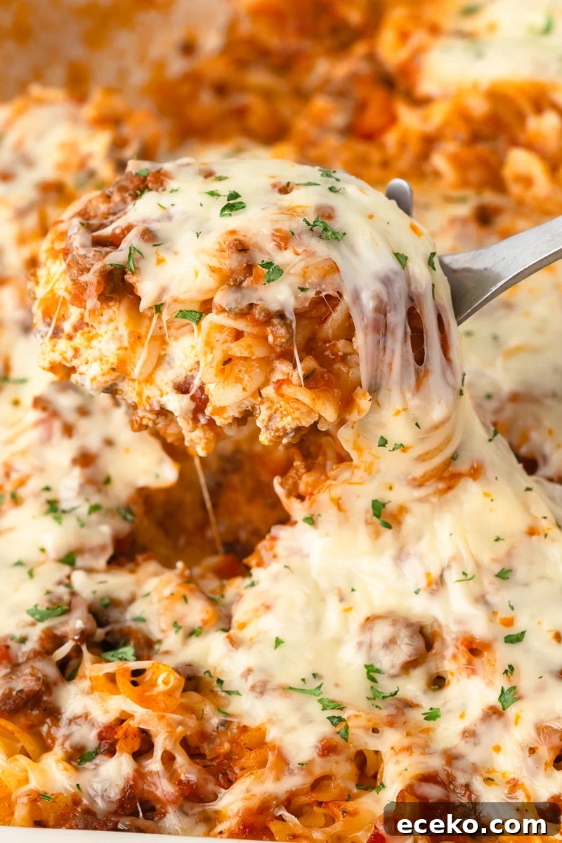 One-Pan Ricotta Lasagna Casserole Recipe 5 Lasagna casserole with a scoop of it being lifted out.